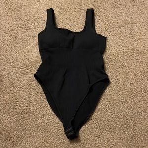 Women’s black body suit